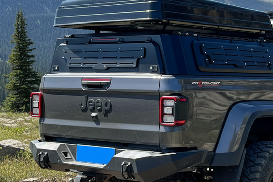 Gray Jeep truck with roof rack canopy on a white background